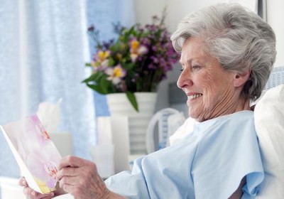 elderly women reading a card